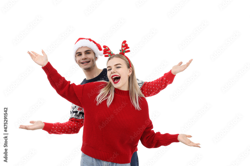 Couple in Christmas clothes isolated on white background
