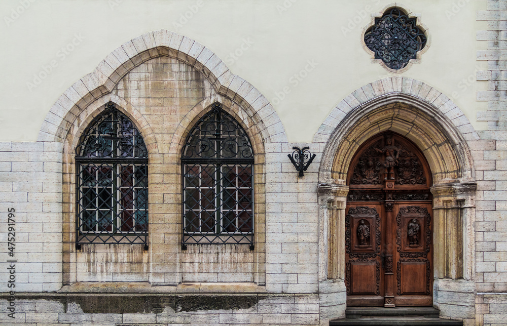 Two windows and door on facade of the urban historic building front view, Tallinn, Estonia
