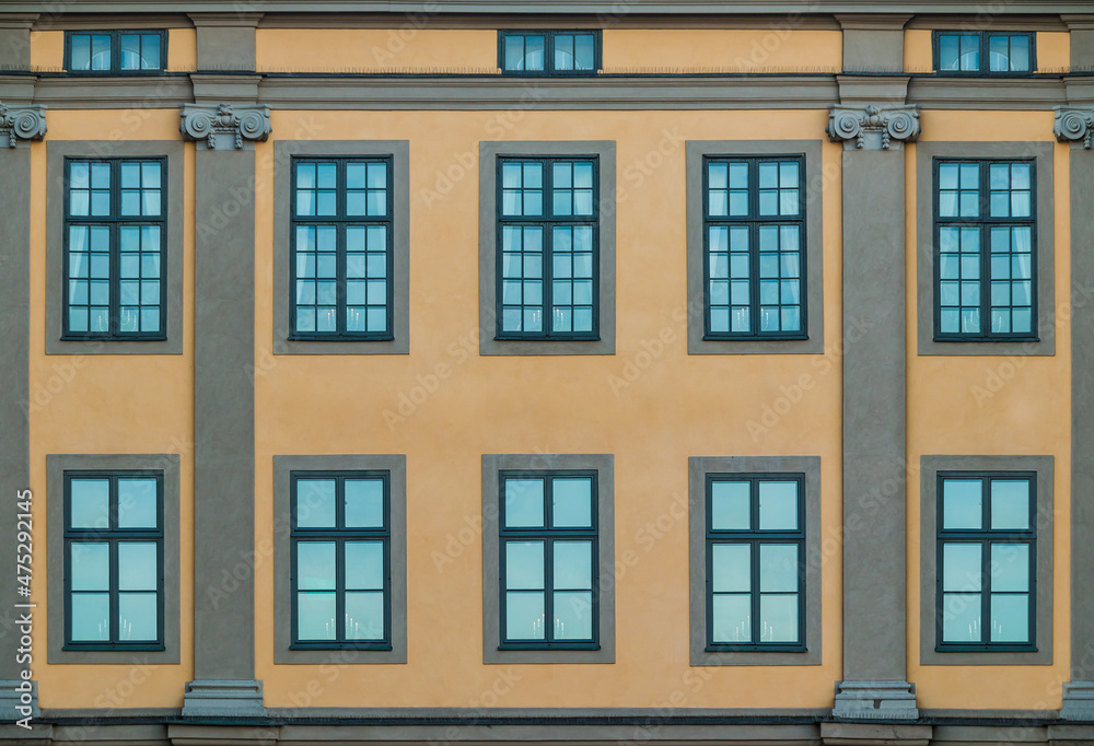 Many windows on facade of the urban historic building front view, Stockholm, Sweden
