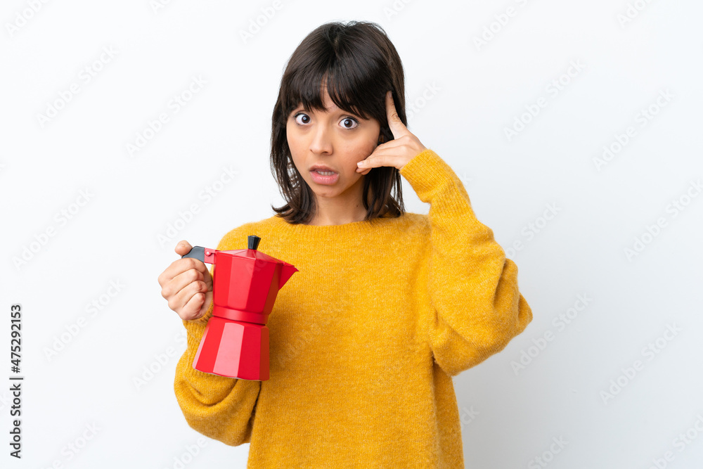 Young mixed race woman holding coffee pot isolated on white background thinking an idea Young mixed race woman holding coffee pot isolated on white background thinking an idea