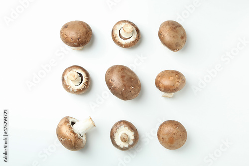 Flat lay composition with champignons on white background