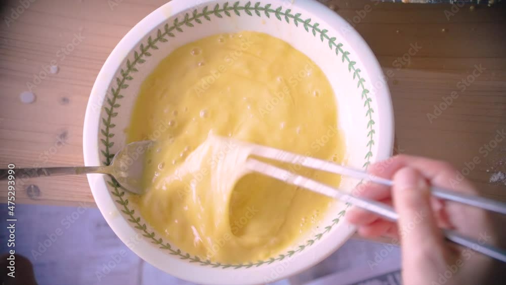 whisking eggs in bowl to cook whisking eggs in bowl to cook