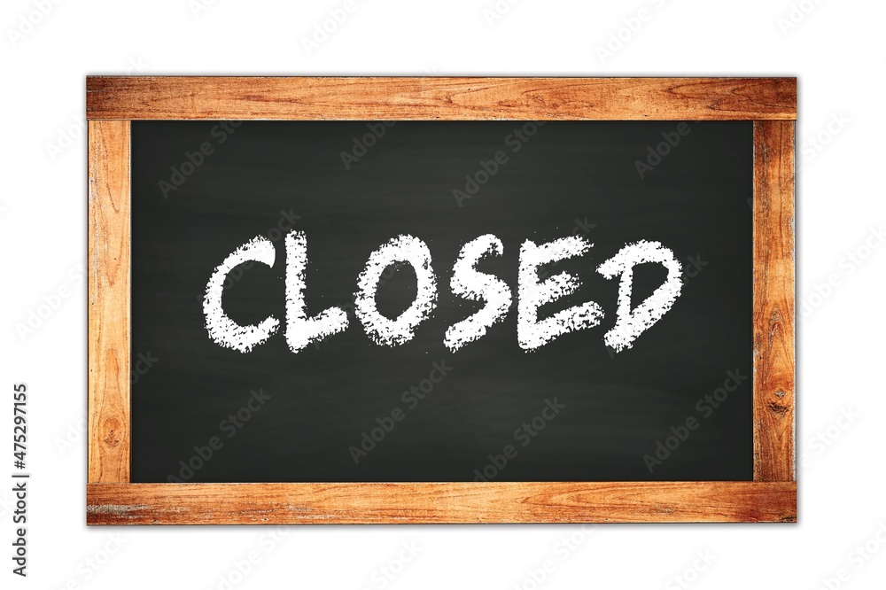 CLOSED text written on wooden frame school blackboard. CLOSED text written on wooden frame school blackboard.