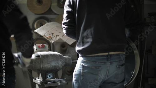 Man at working in a factory.
Handmade manufacture.