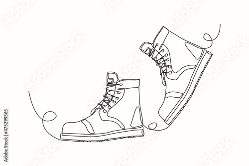 Continuous line drawing of man work boots. Single one line art of safety hiking boots. Vector illustration