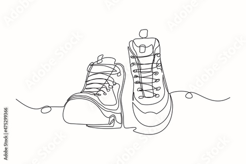 Continuous line drawing of man work boots. Single one line art of safety hiking boots. Vector illustration photo