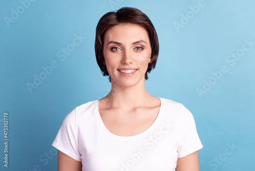Photo of young attractive woman good mood toothy smile visit dentist cavity protection isolated over blue color background