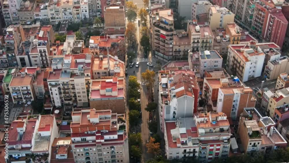 Aerial drone view of Barcelona, Spain. Blocks with multiple residential buildings, roads with cars Aerial drone view of Barcelona, Spain. Blocks with multiple residential buildings, roads with cars