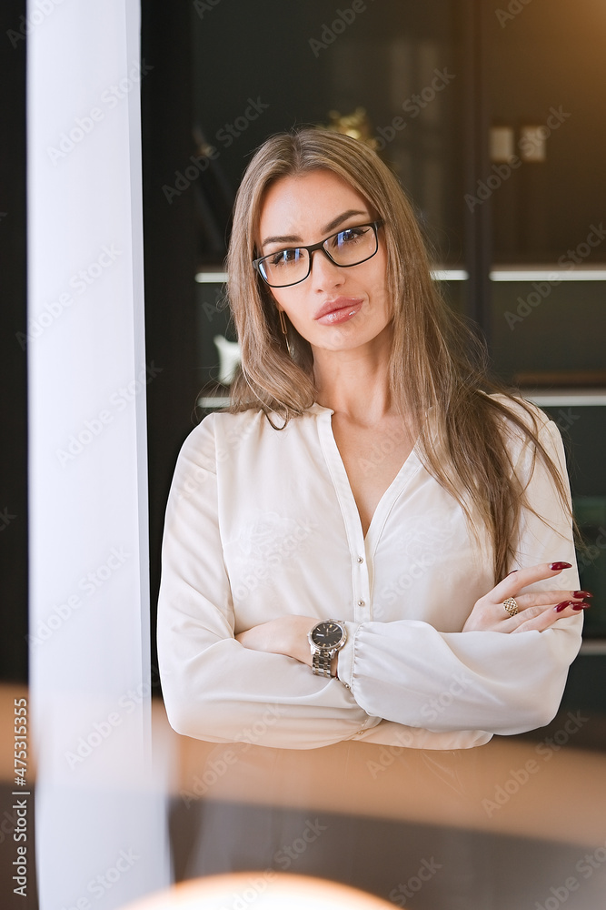 Portrait of smiling pretty young business woman in glasses Portrait of smiling pretty young business woman in glasses