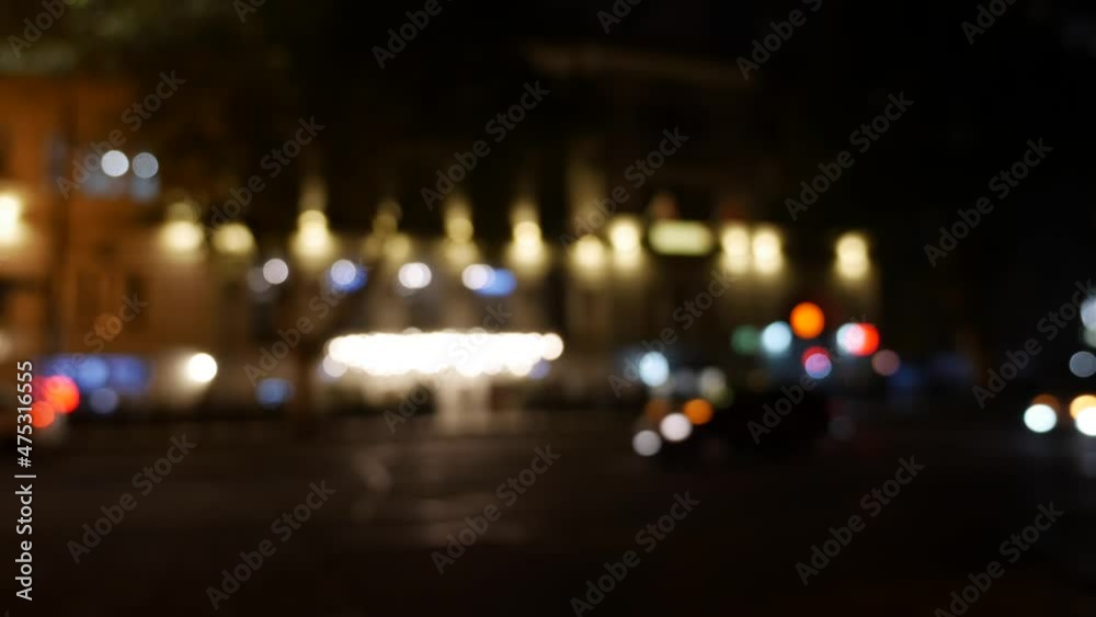 Beautiful glittering bokeh in dark blurry background at night. The round colorful bokeh shine from car lights on city street. Out of focus with blurry. Unfocused city lights. Traffic bokeh. Abstract Beautiful glittering bokeh in dark blurry background at night. The round colorful bokeh shine from car lights on city street. Out of focus with blurry. Unfocused city lights. Traffic bokeh. Abstract
