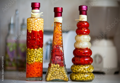 Spice bottles with pickles.