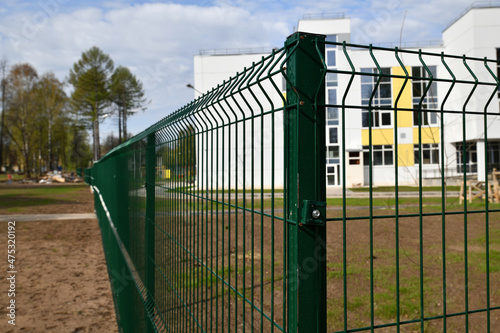 part of the iron green metal fence