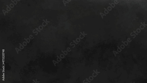 Old black background. Grunge texture. Dark wallpaper. Blackboard. Chalkboard. Cement wall dark edges textured background.