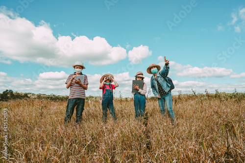 Kids and mother journey and travel on hills on blue sky background