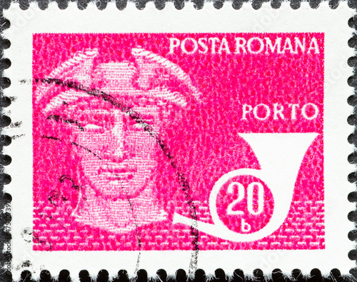 Romania - circa 1974: A post stamp printed in Romania showing Hermes the messenger of the gods with posthorn photo