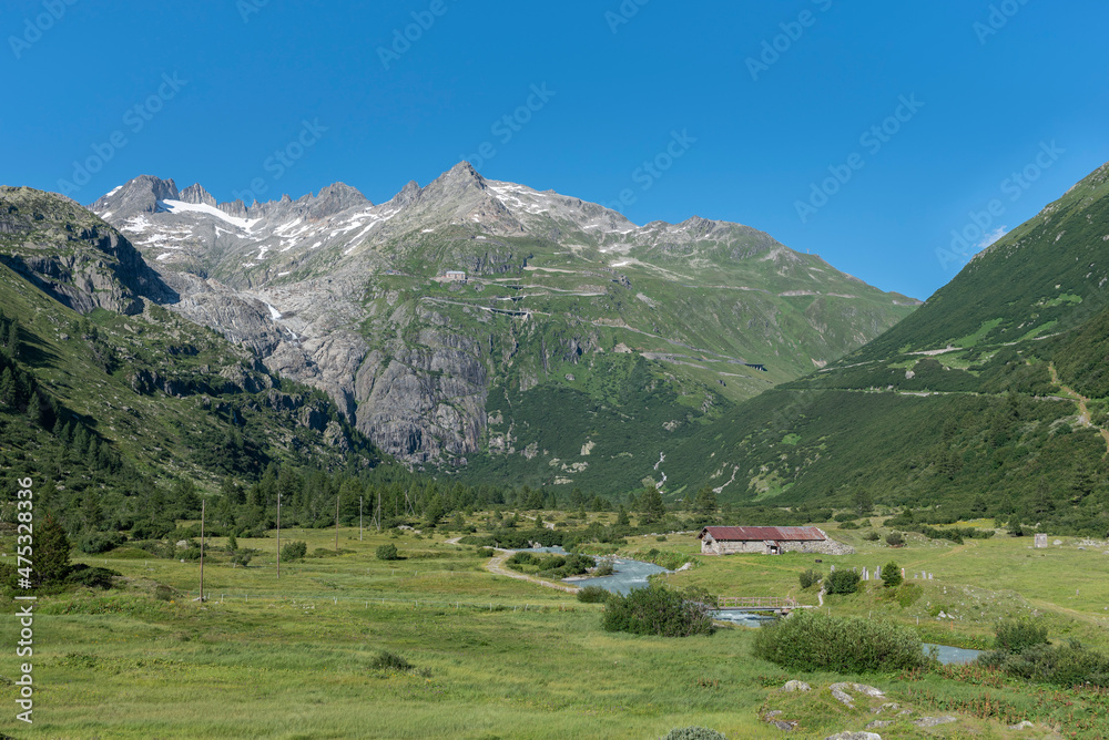 Rhone Valley near the hamlet of Gletsch with the Rhone River in front of the Rhone Glacier