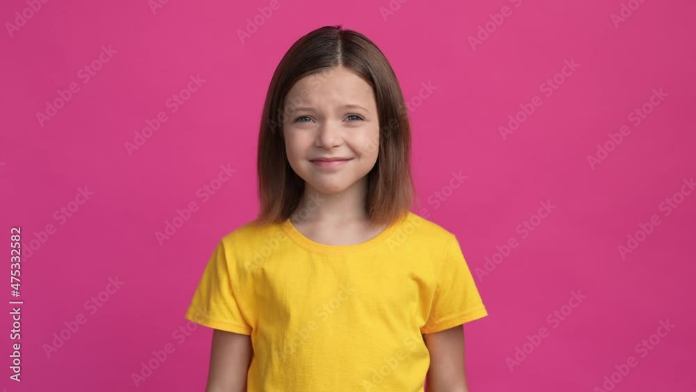 Schoolchild hide finger ears volume music isolated fuchsia color background Schoolchild hide finger ears volume music isolated fuchsia color background
