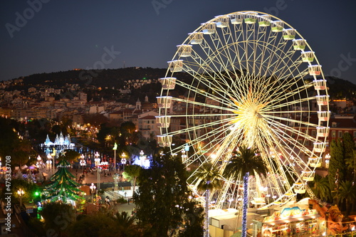 Christmas Market and decorations and funfair Ferris wheel. Nice, France