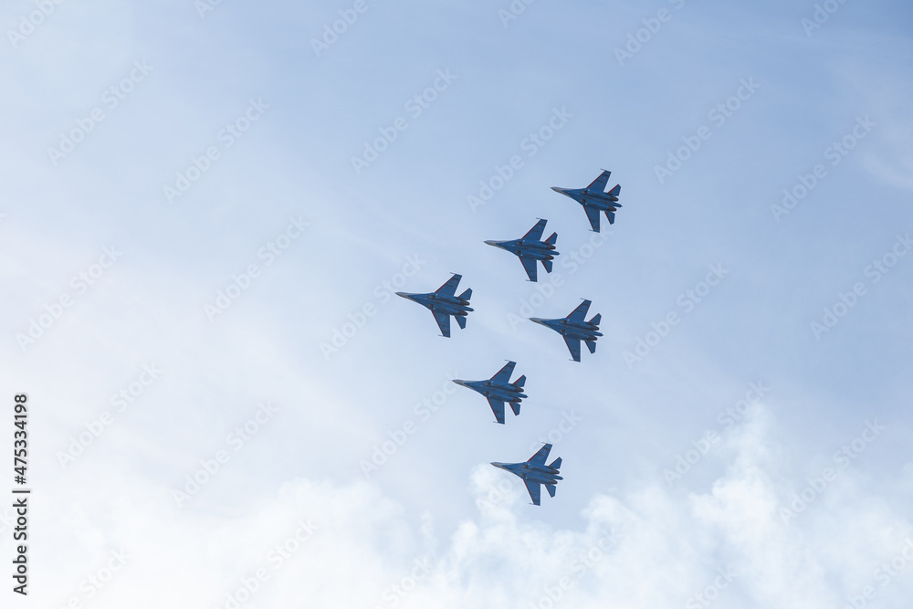 Russian fighter jets fly over a blue sky Russian fighter jets fly over a blue sky