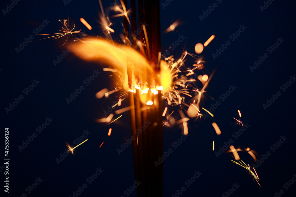 Sparklers close-up, special blur, focus on sparks.
