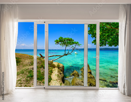 large glass door overlooking the beach