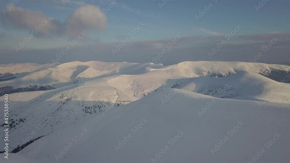 Aerial view of mountain snow-capped peak, at sunrise Aerial view of mountain snow-capped peak, at sunrise