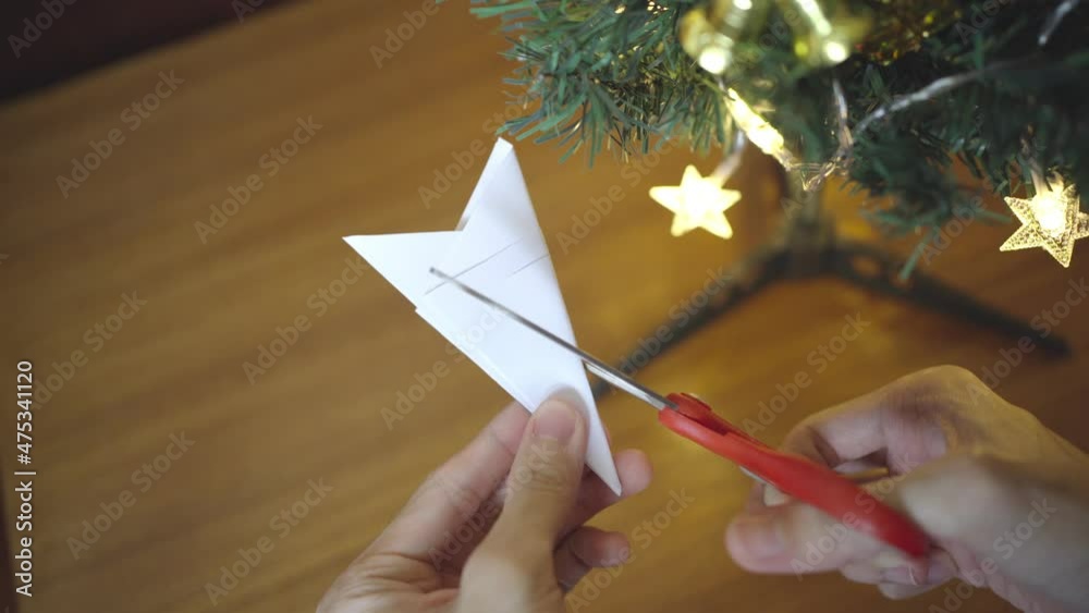 Making snowflake shape from white paper