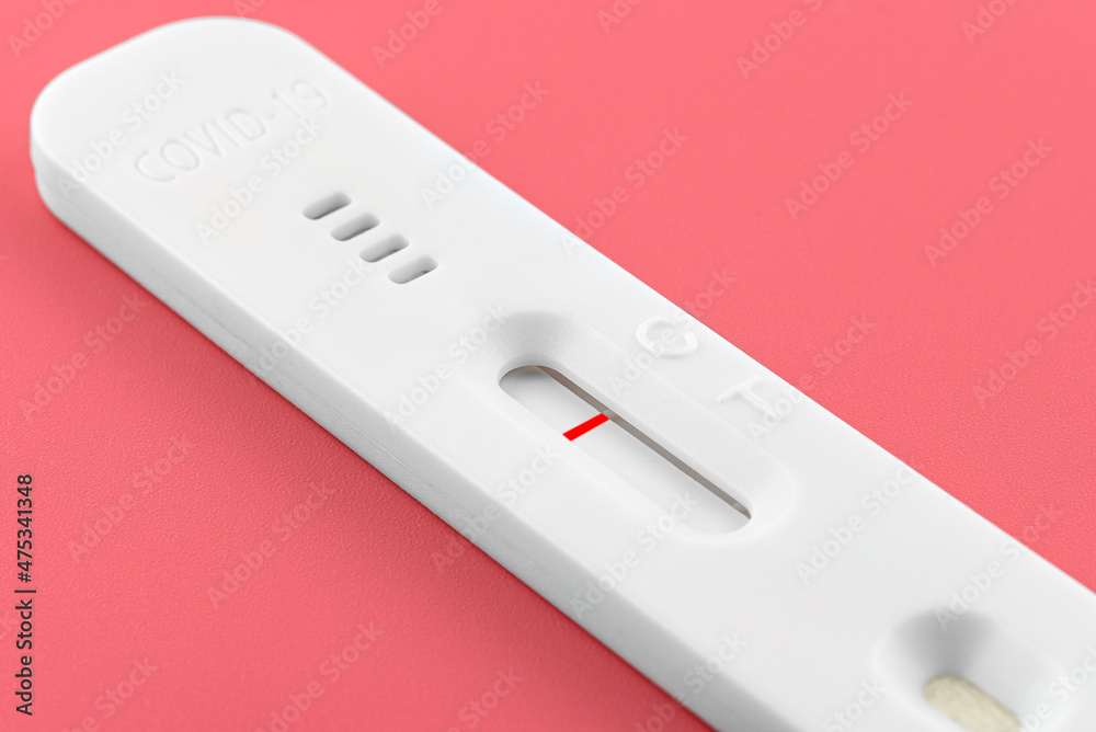Coronavirus negative antigen test for nasal swab, isolated on a pink background with clipping path. Coronavirus negative antigen test for nasal swab, isolated on a pink background with clipping path.