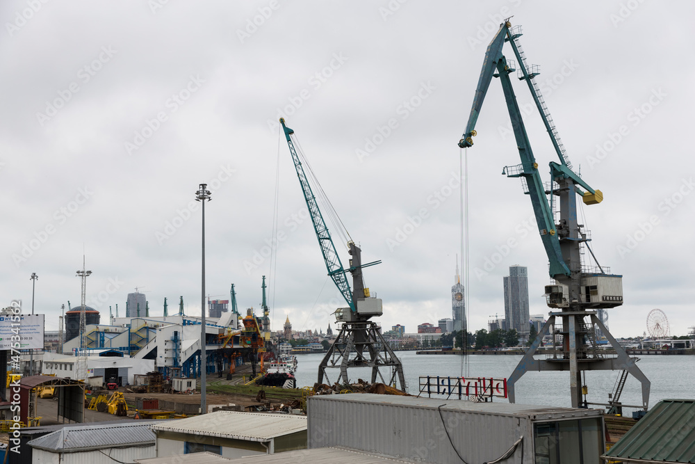Batumi, Georgia - June 26, 2021: View of the seaport of Batumi. Port cranes. 