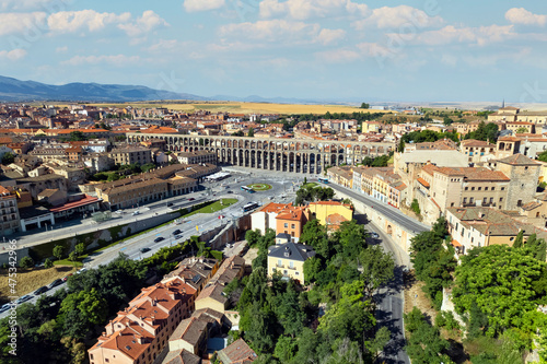 Aerial shoot Segovia cityscape and medieval Roman Aqueduct. Spain