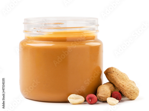 Fotografie, Obraz Peanut butter in a jar with peanuts on a white background
