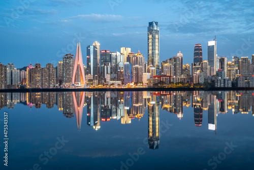 cityscape and skyline of downtown near water of chongqing at night © 昊 周