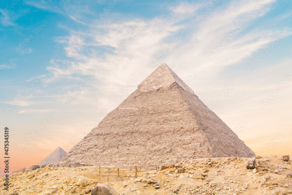 Great Sphinx against the background of the pyramids of the pharaohs Cheops, Khafren, and Mikerin in Giza, Egypt