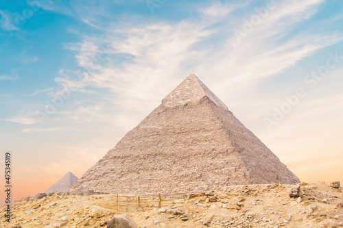 Great Sphinx against the background of the pyramids of the pharaohs Cheops  Khafren  and Mikerin in Giza  Egypt