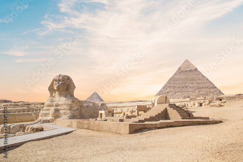 Great Sphinx against the background of the pyramids of the pharaohs Cheops  Khafren  and Mikerin in Giza  Egypt