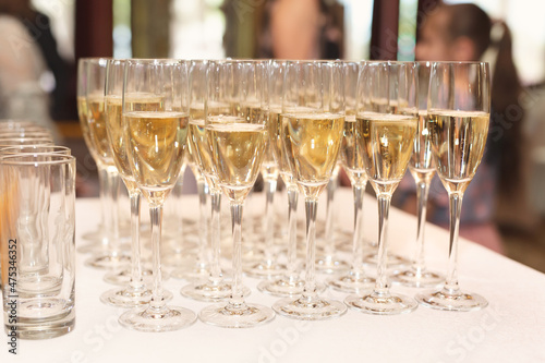 Bride and groom champagne glasses at a wedding reception.