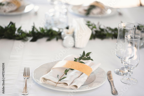 Beautiful setting of the wedding banquet table in the restaurant.