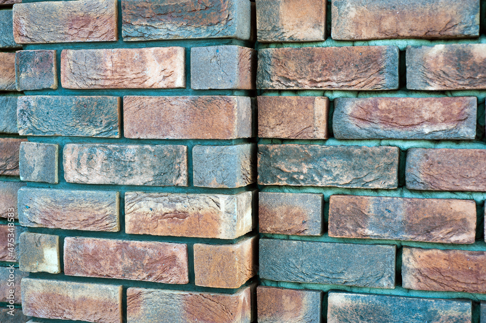 Fototapeta premium red old brick wall background, brick wall texture, structure. old broken brick, cement joints, close-up.