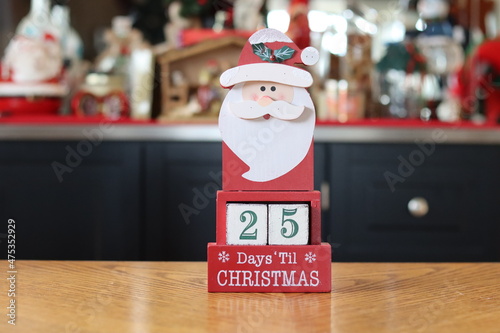 Santa Claus with Christmas gifts, countdown 25 days until Christmas photo