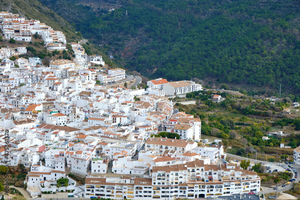 Ojén Spain urban view of the city with beautiful green nature around on a cloudy day, small Spanish old town