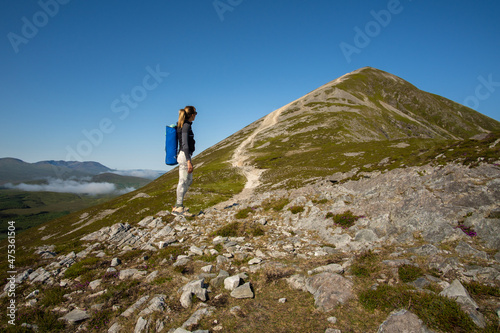 Woman climbing the Croagh Patrick mountain © Cavan