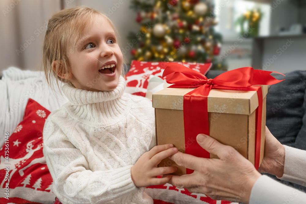 girl receives a gift from her grandmother girl receives a gift from her grandmother