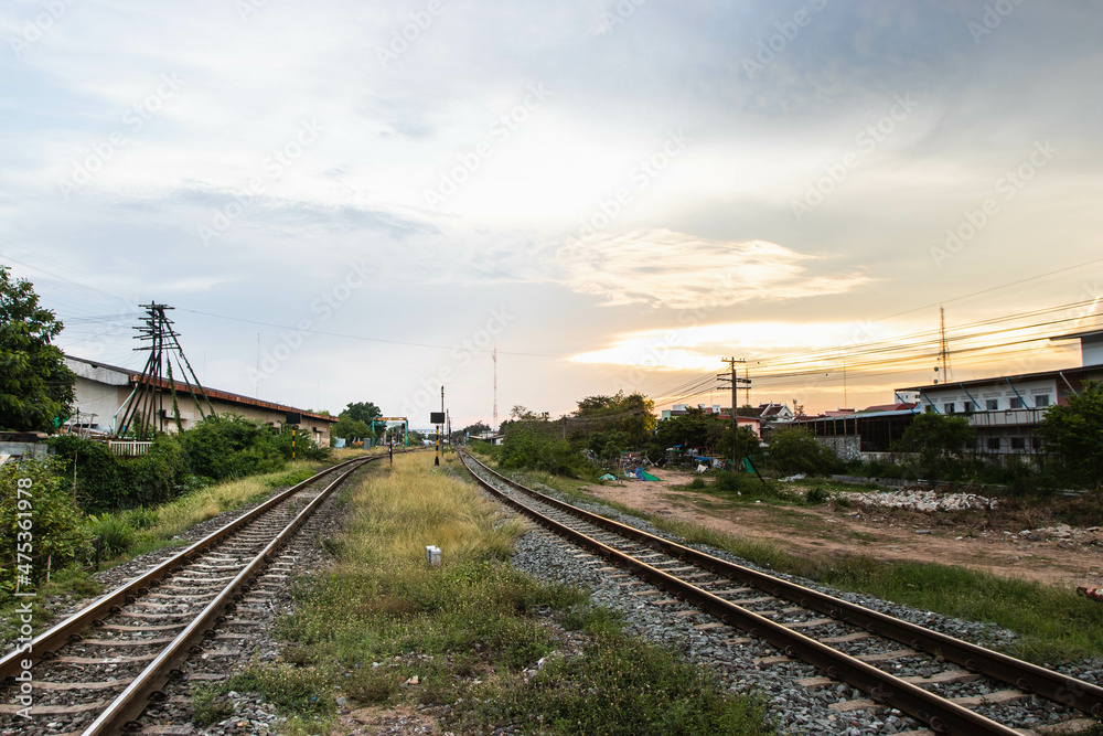 Railroad tracks with sunset in rural, Thailand