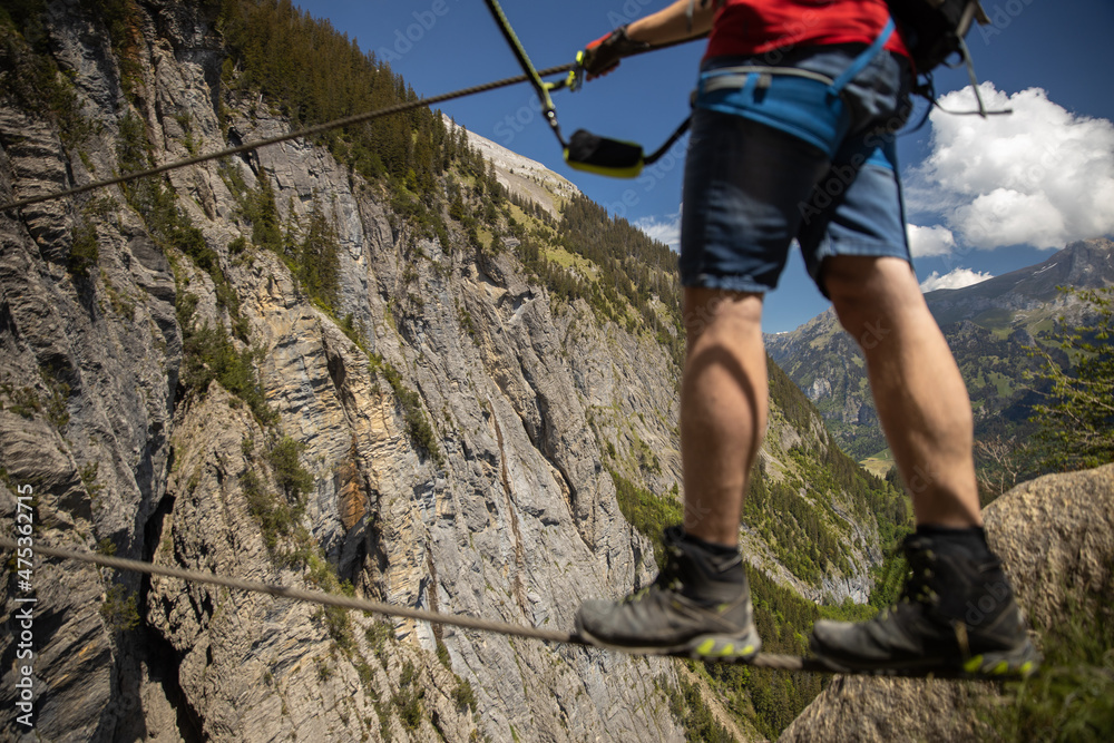 Kandersteg - amazing vacation destination in the Swiss Alps, Switzerland. Couple on a lovely via ferrata Kandersteg - amazing vacation destination in the Swiss Alps, Switzerland. Couple on a lovely via ferrata