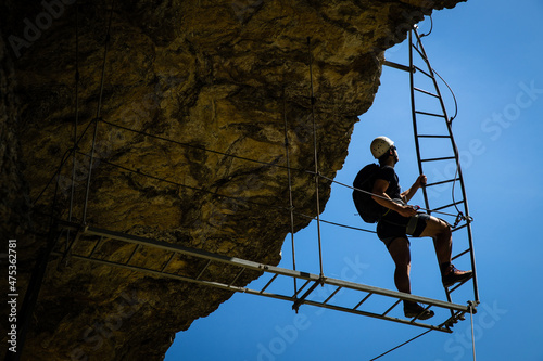 Young people on a via ferrata route in Swiss Alps photo