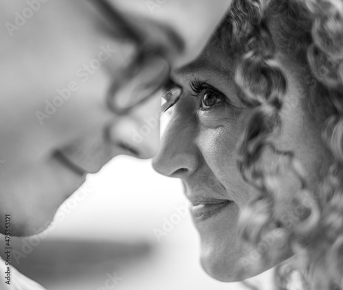 Close up of woman looking with love into husband's eyes photo