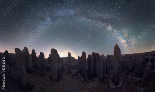 Panorama of Megalithic monuments under stars sky with Milky Way arch photo