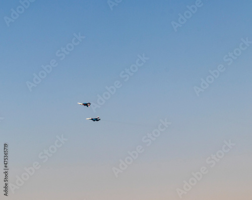 Military airplanes performing stunts in clear blue sky. Airshow © Four_Lakes