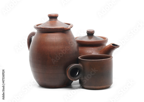 Earthenware isolated on white background: ceramics jug (herbalist), ceramic teapot, ceramic cup.
