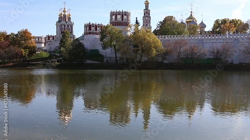 View of the Novodevichy convent (Bogoroditse-Smolensky monastery) and the big Novodevichy pond on a sunny autumn day. Moscow, Russia. UNESCO world heritage site photo